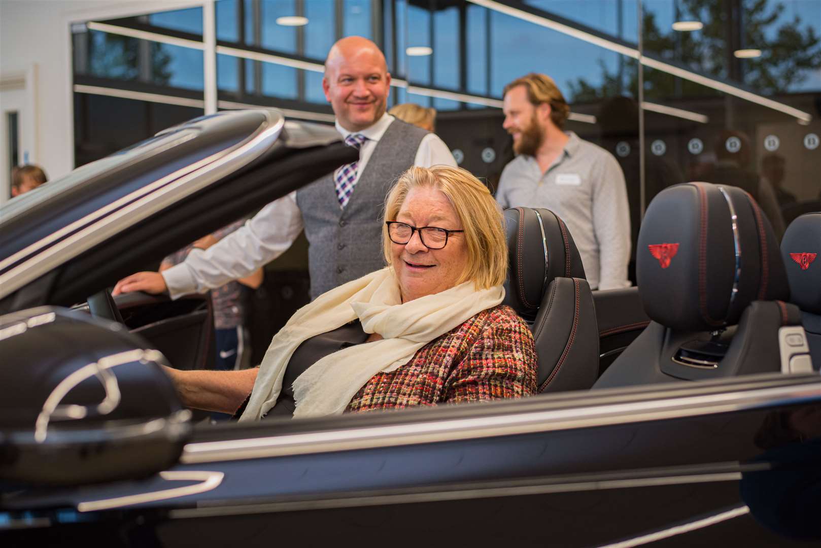 Crazy Jeans ambassador Rosemary Schrager in a Bentley at the launch with showroom manager Jon Lovell