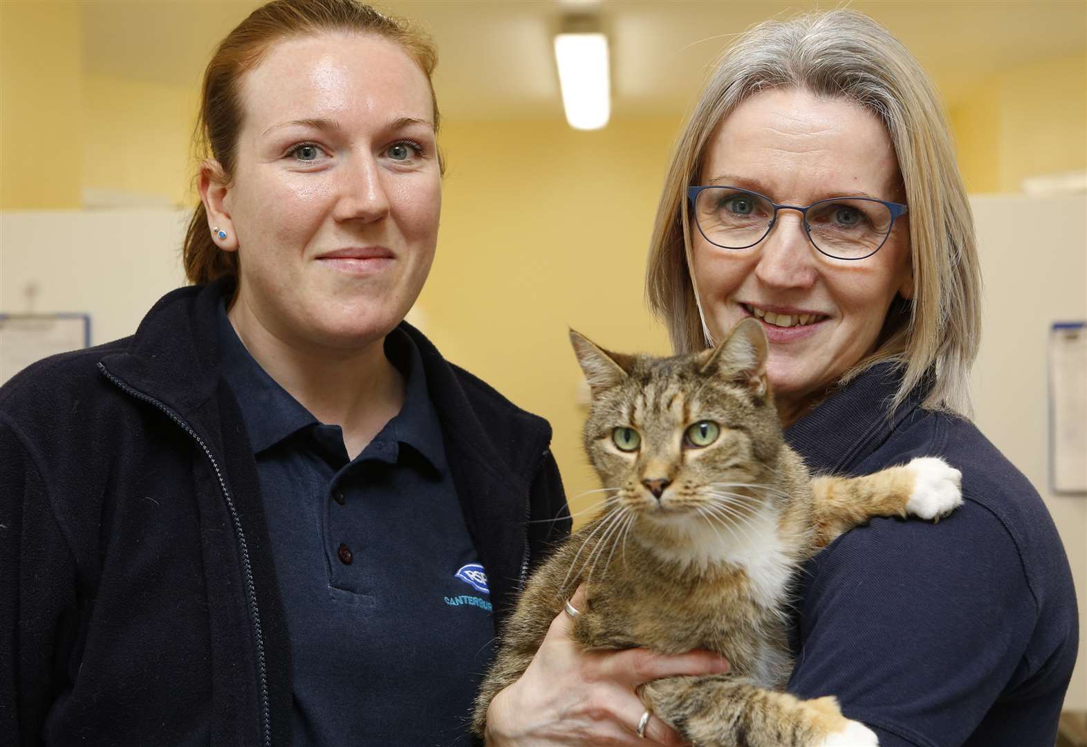 Rachel Currie and Linda Long with Sky, one of the cats that needs a home