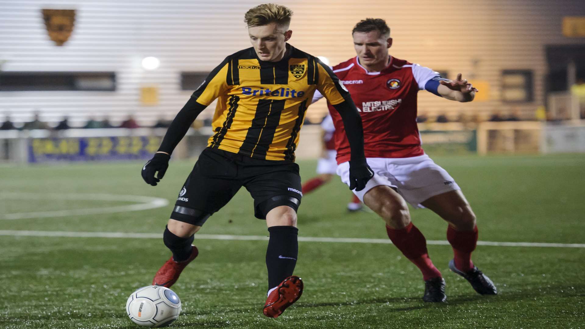 Maidstone forward Joe Pigott is tracked by Ebbsfleet's Dave Winfield Picture: Andy Payton
