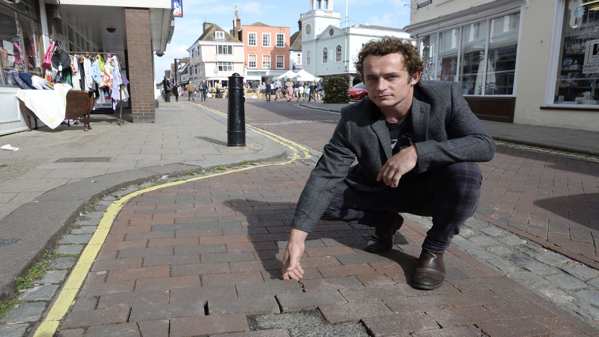 Oliver Sebastien points out the uneven cobbles where the elderly man injured himself.
