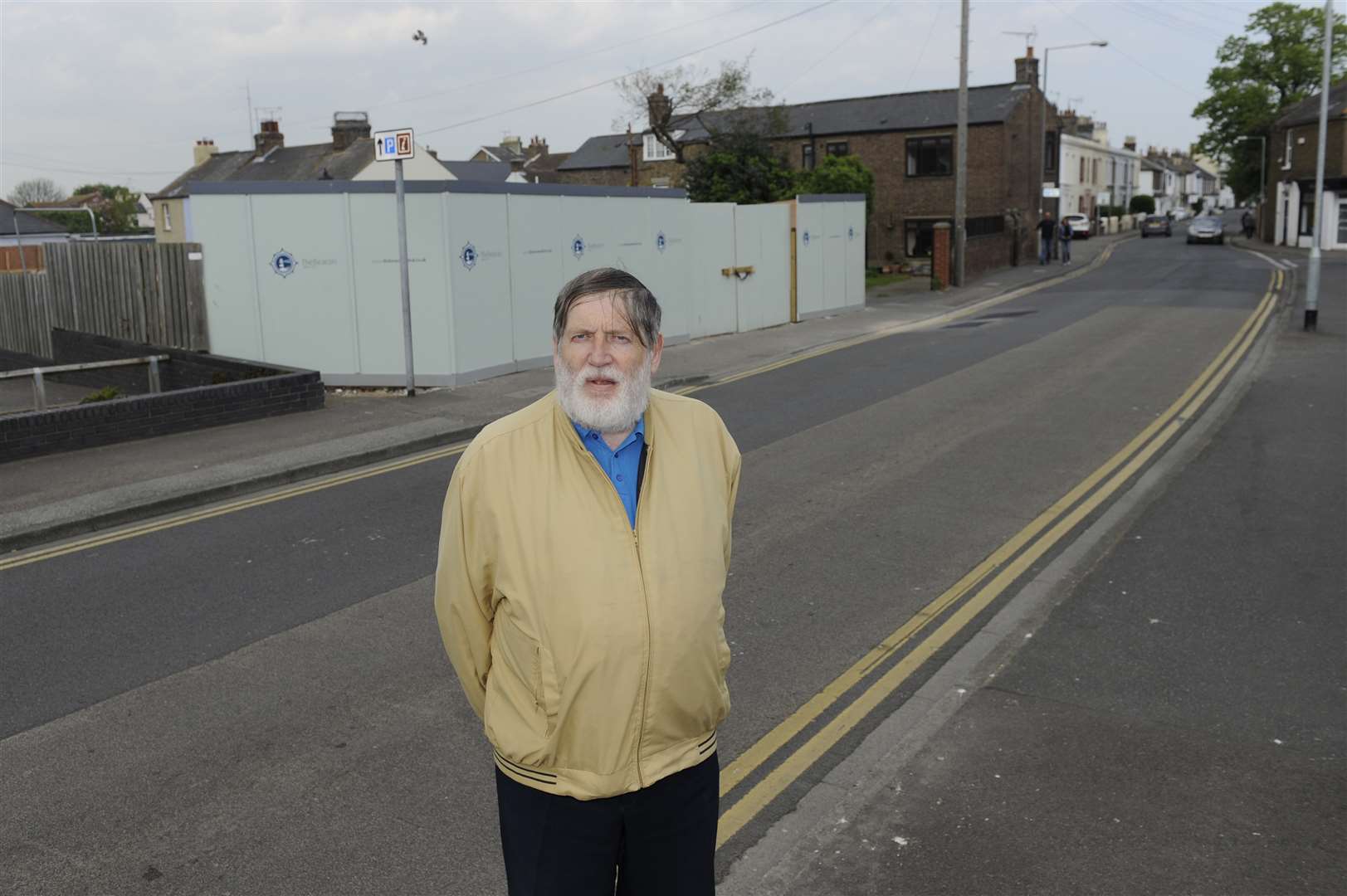 Cllr Bill Gardner outside the site where 17 flats are proposed