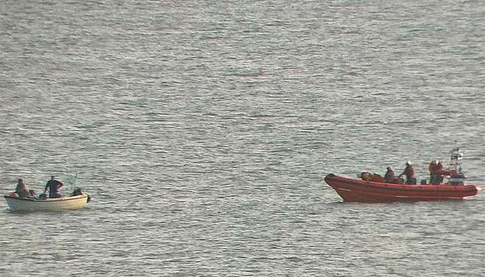 Lifeboat volunteers reach the stranded vessel at anchor off the coast of Herne Bay