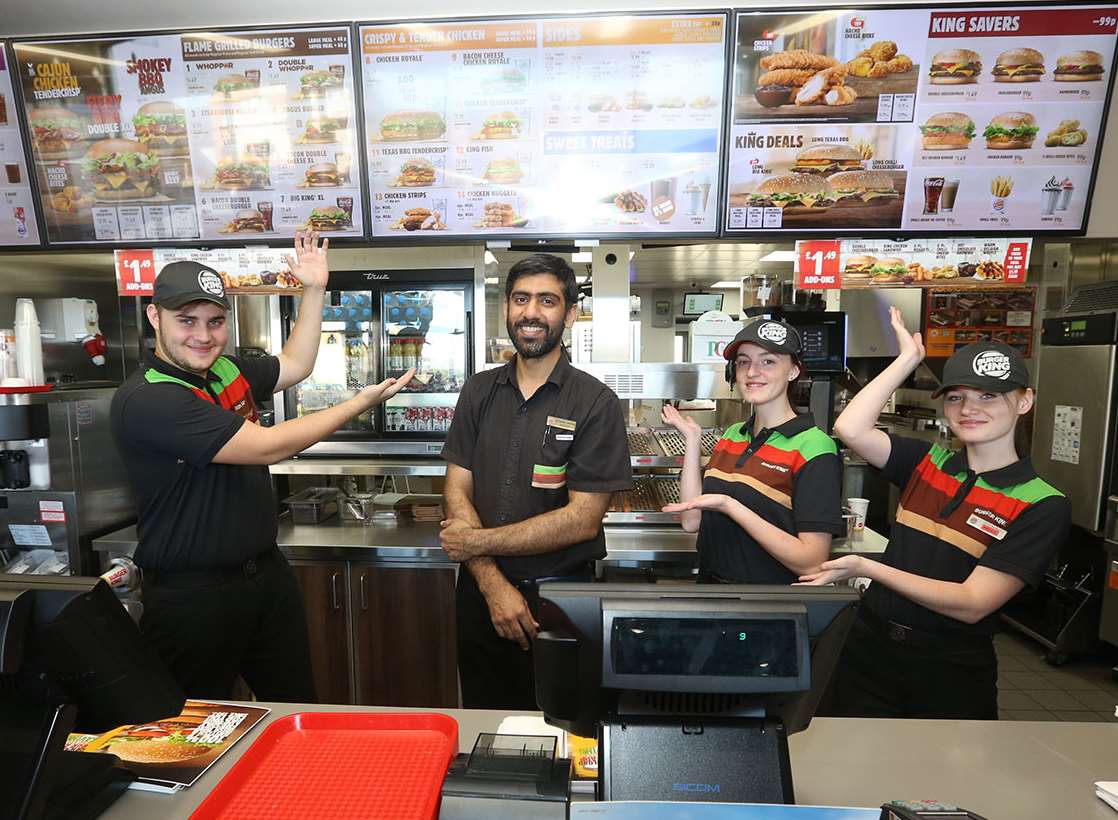 Staff ready for first customers at Burger King, Neats Court, Queenborough with manager Naveed Chatta.