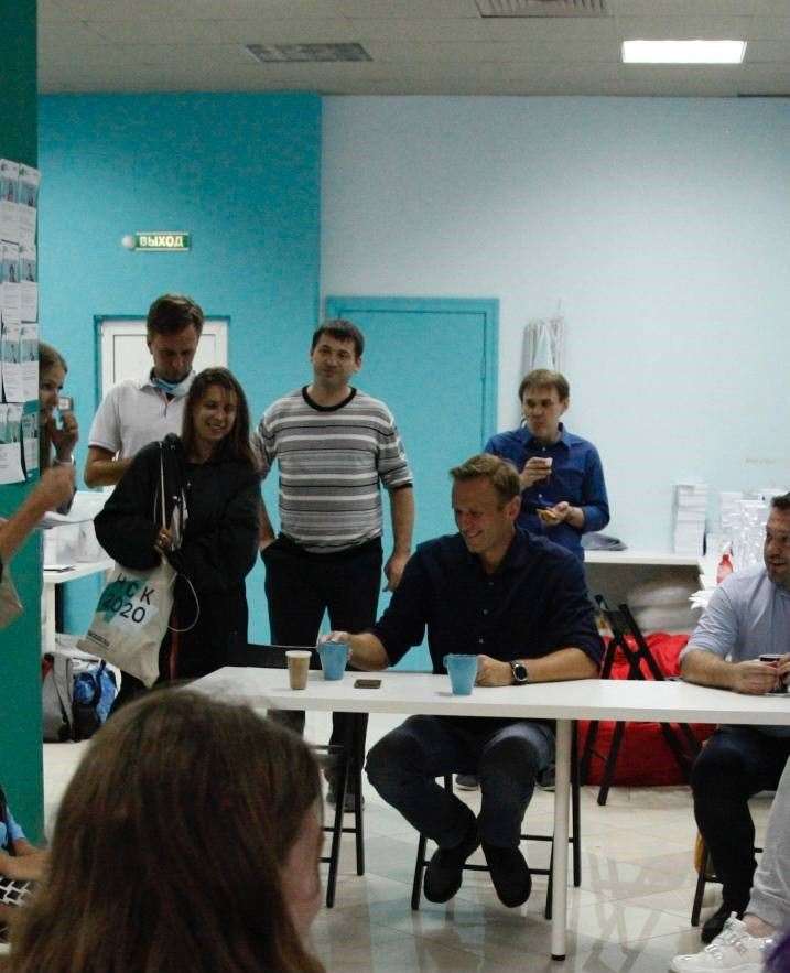 Ekaterina Aleksandrova (standing, second from the left) and Alexei Navalny (seated) in Novosibirsk, Russia in 2020 (Ekaterina Aleksandrova/PA)