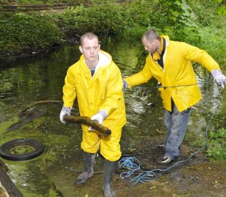 Offenders help perform clean-up work at Oare Gunpowder Works. Picture: Andy Payton