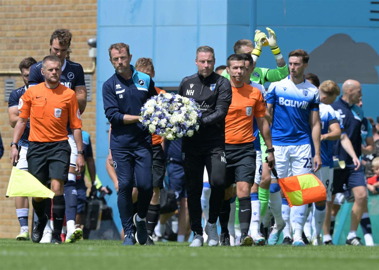 Neil Harris and Gary Rowett lead the teams out with a tribute to the Millwall owner John Berylson who recently died Picture: Keith Gillard