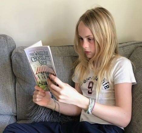 Ellie getting stuck into a book