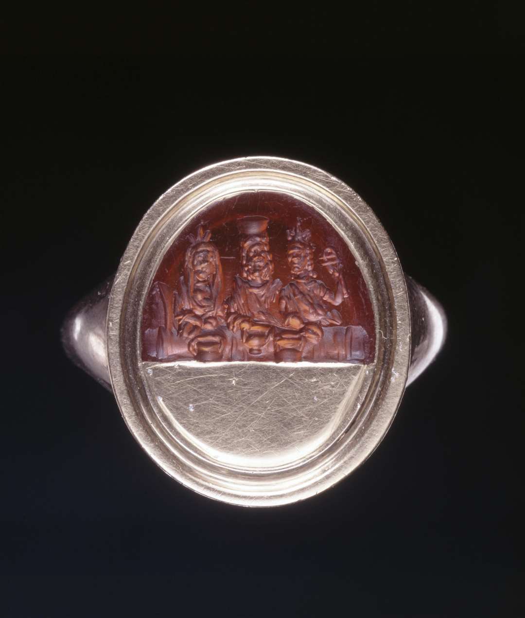 The upper part of a sard gem engraved with Sarapis wearing a calatho, 1st-3rd century AD, similar to the items missing. (The Trustees of the British Museum/PA)