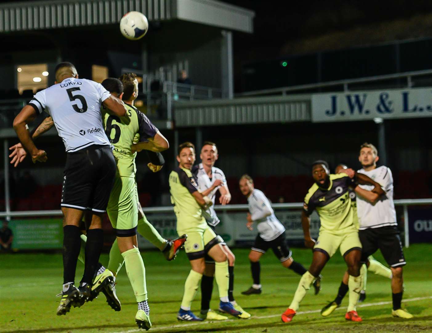 Returning Dover skipper Kevin Lokko gets up well against Boreham Wood Picture: Alan Langley