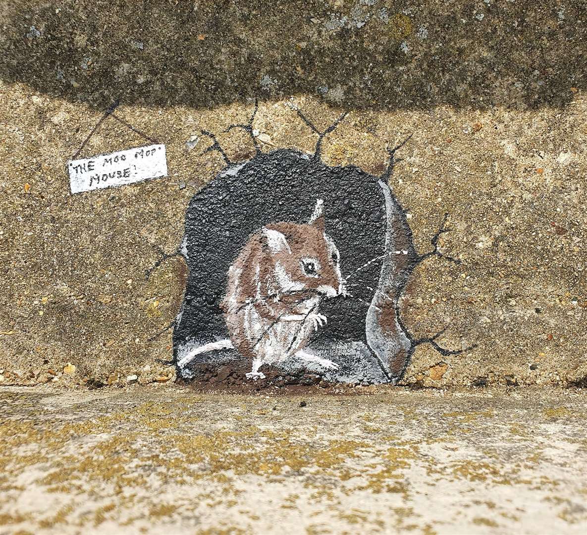 One of the first Moo Mop Mouse paintings on the sea wall at Minster on the Isle of Sheppey