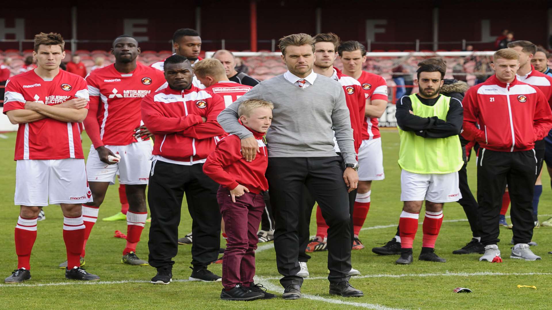 Dejected Ebbsfleet players watch Maidstone collect their medals Picture: Andy Payton