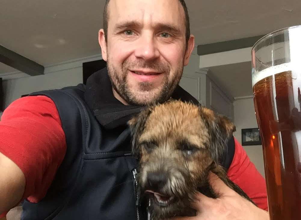 Richard Latter, 40, with the 9-month-old border terrier.