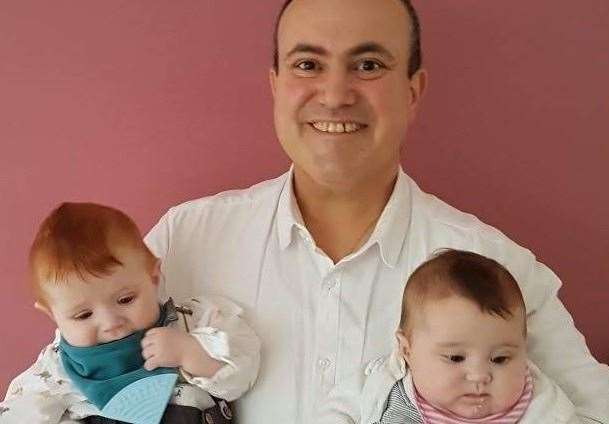 Georgios Antikatzidis with his twin daughters