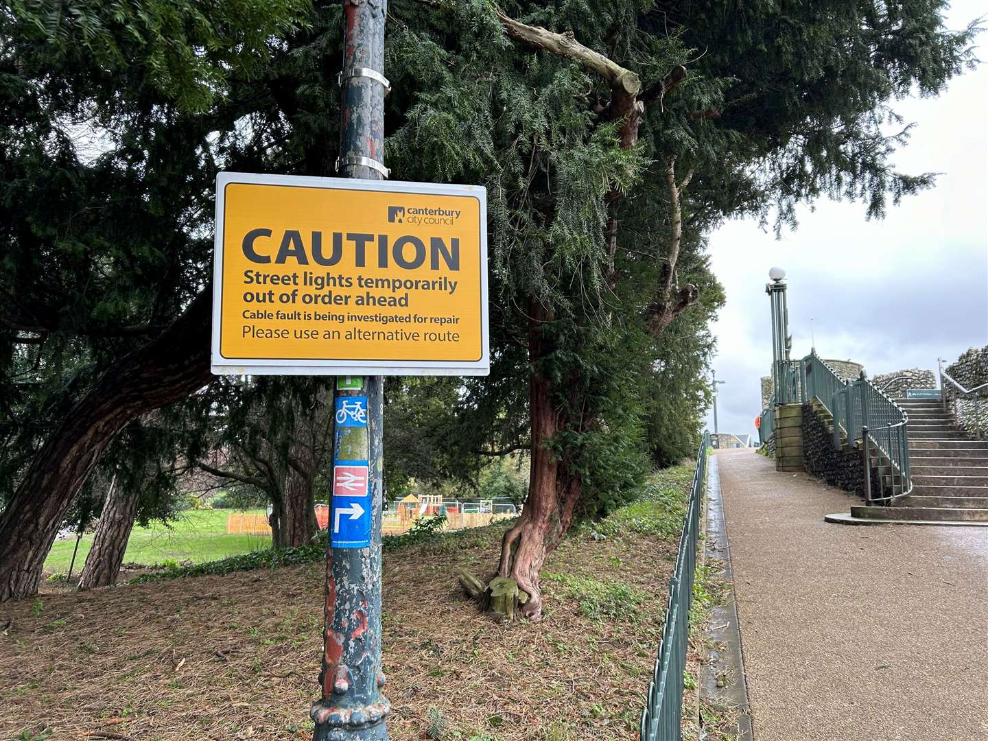 A sign in Dane John Gardens, Canterbury warning people the lights are not working