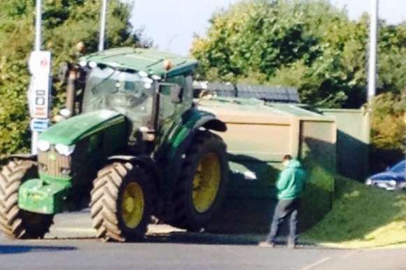 Tractor's rear wheels in air after trailer flip