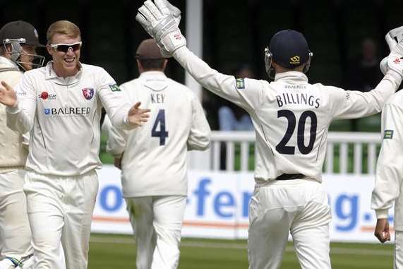 Kent off-spinner Adam Riley celebrates with wicketkeeper Sam Billings last season. The pair have both been named in provisional England Lions squads to tour South Africa next year. Picture: Barry Goodwin