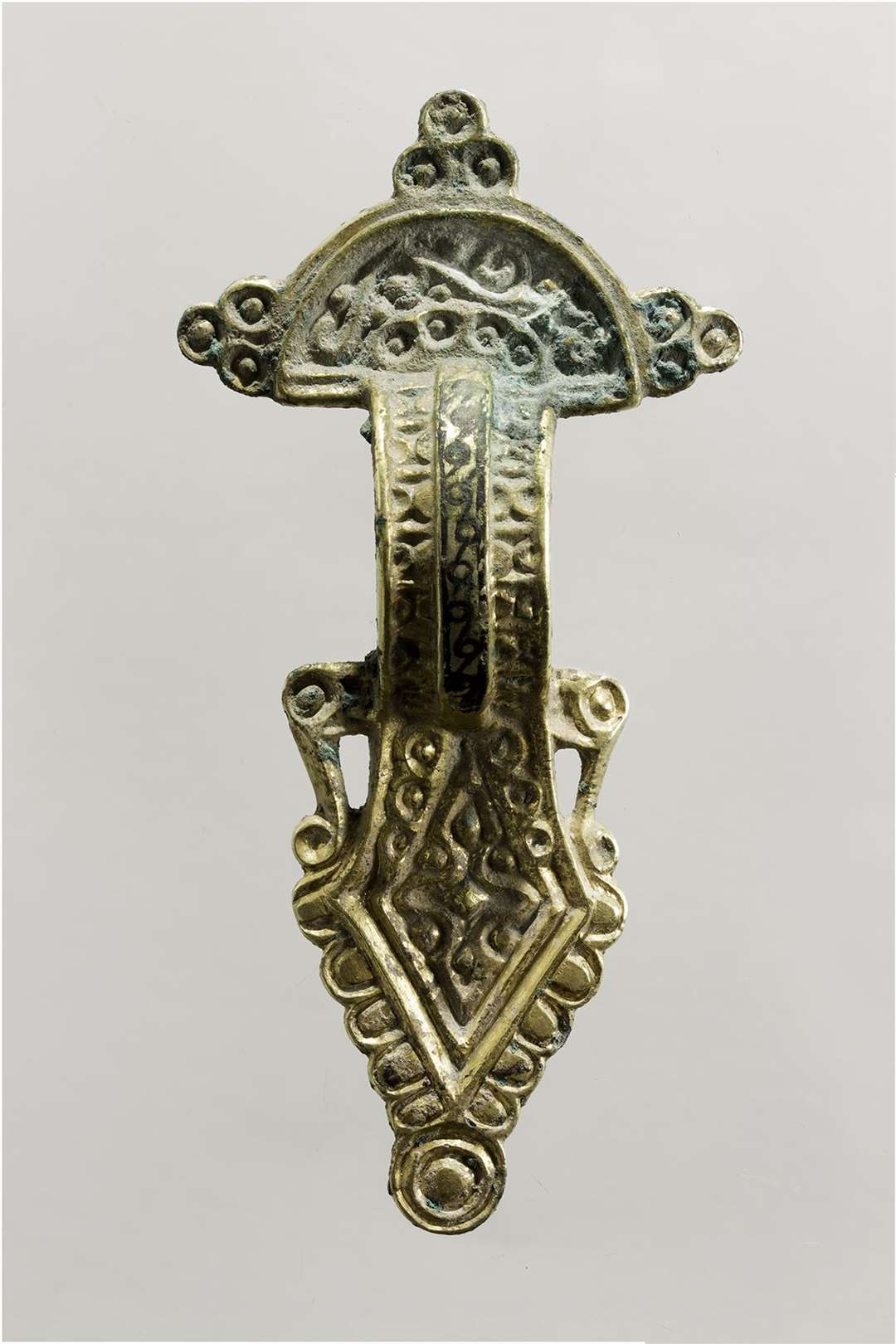 A 6th Century silver gilt brooch found at the site. Image from Pre-Construct Archaeology