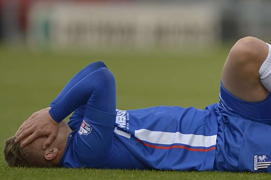 Gills striker Luke Norris suffers an ankle injury at Crewe Picture: Barry Goodwin