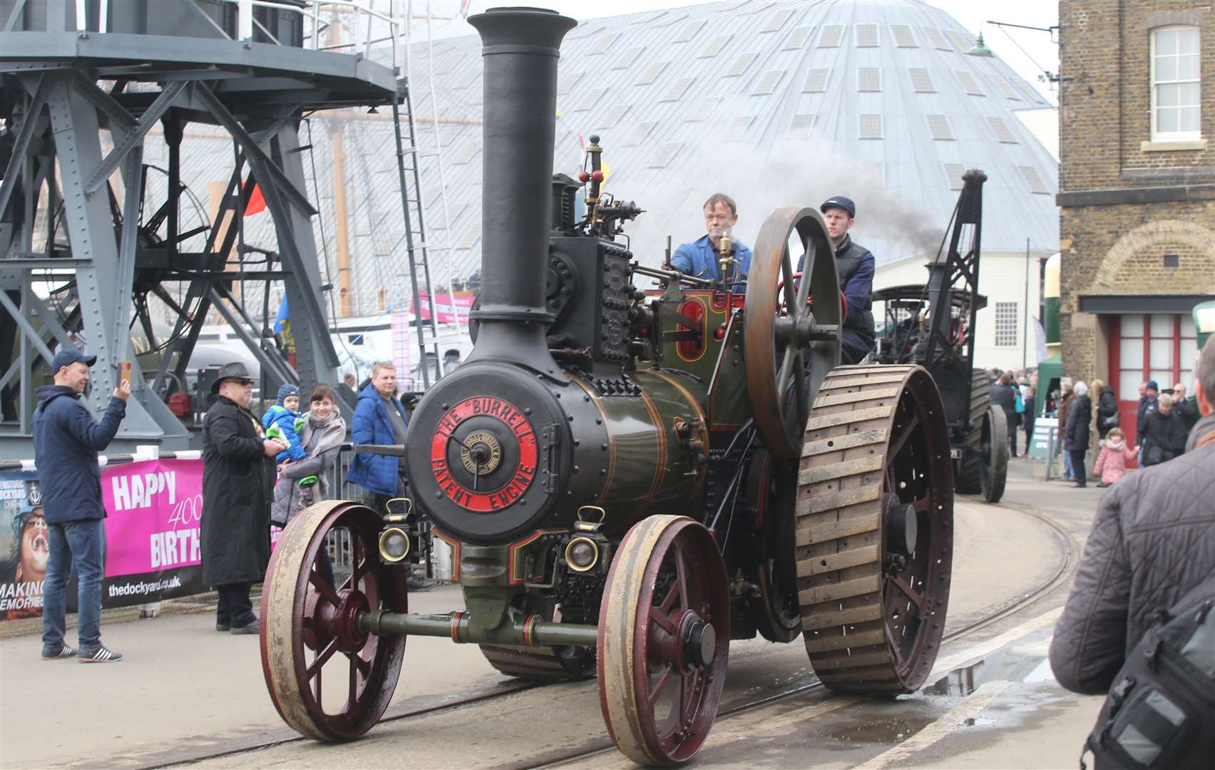 Steam engines drive past crowds during the Festival of Steam at Chatham Dockyard. Picture by: John Westhrop
