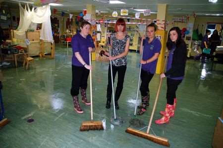 staff mop up at The Acorns Nursery