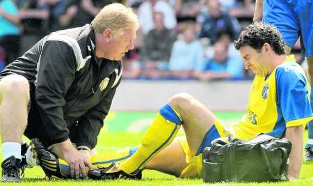 Kevin Maher receives treatment from Gills physio Paul Smith