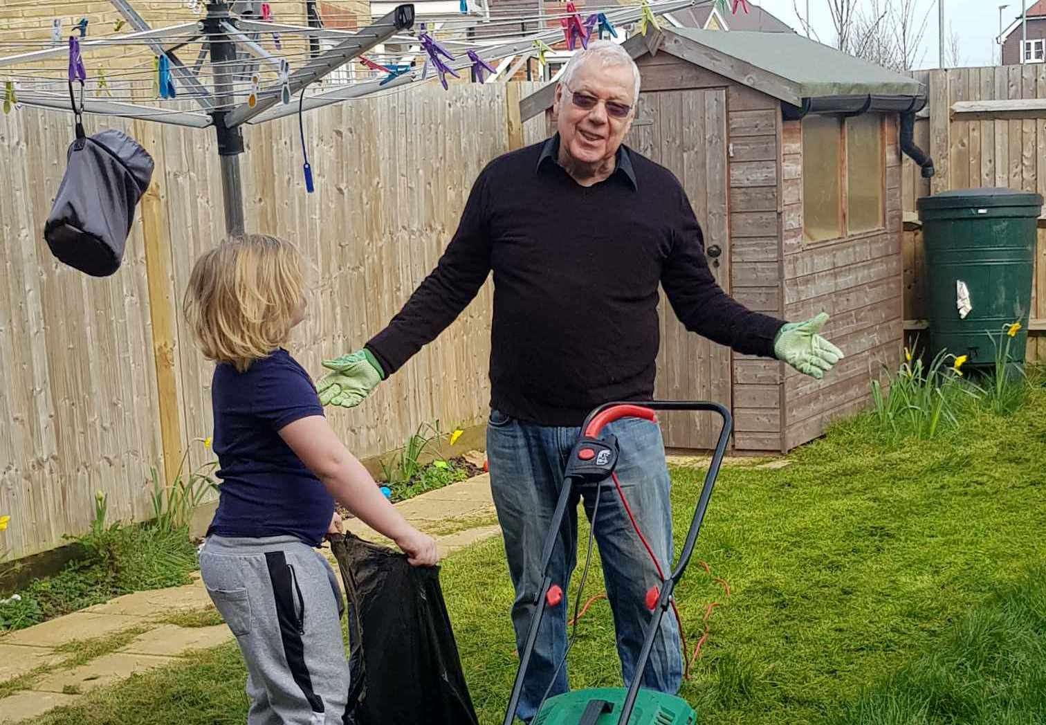Malcom Sapsed in the garden with one of his grandchildren. Picture: Lacey Sapsed