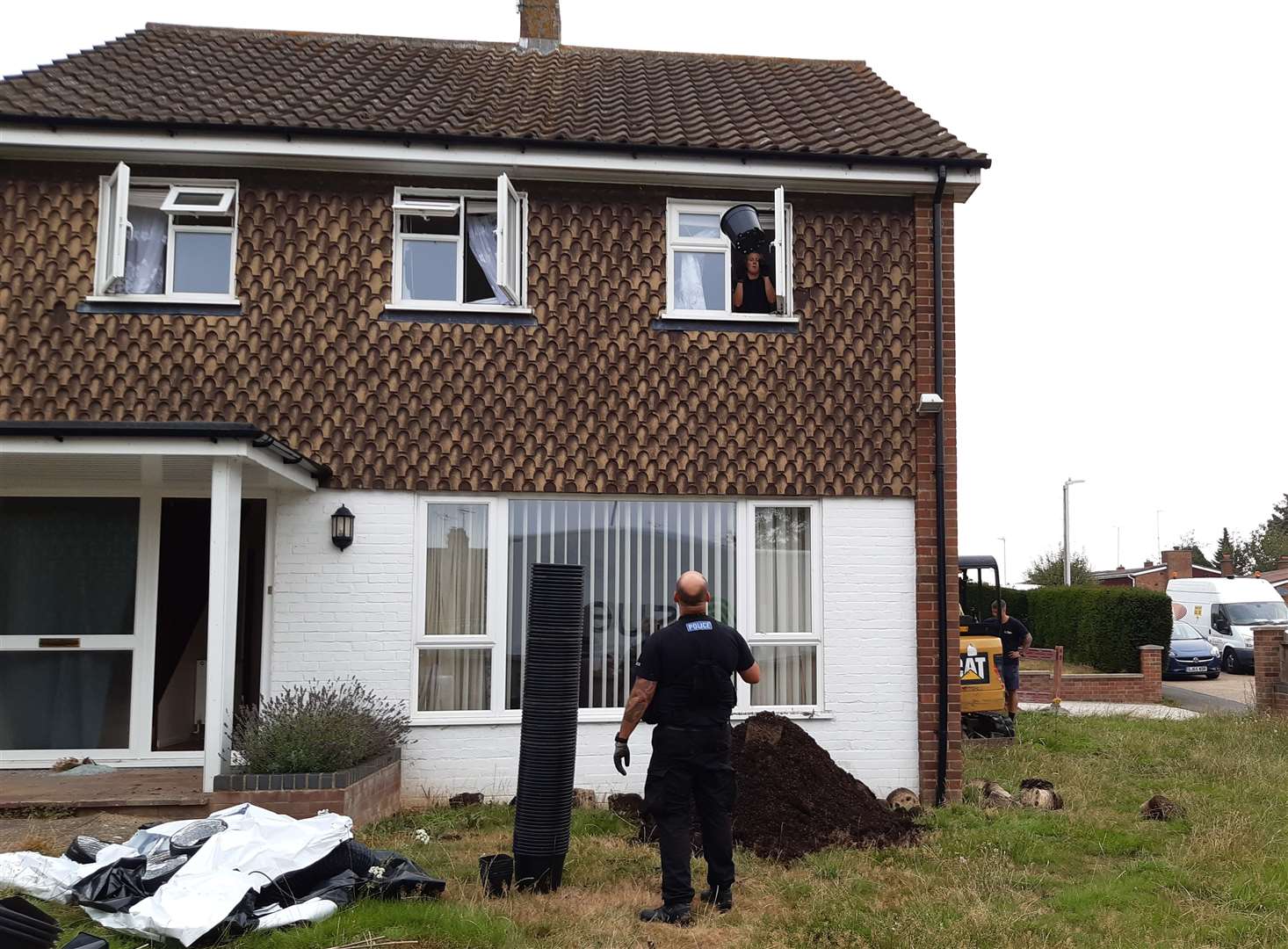 An officer was seen throwing plant pots out of a bedroom window on Friday