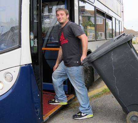 David Bridgman attempts to take his wheelie bin to the tip on the bus
