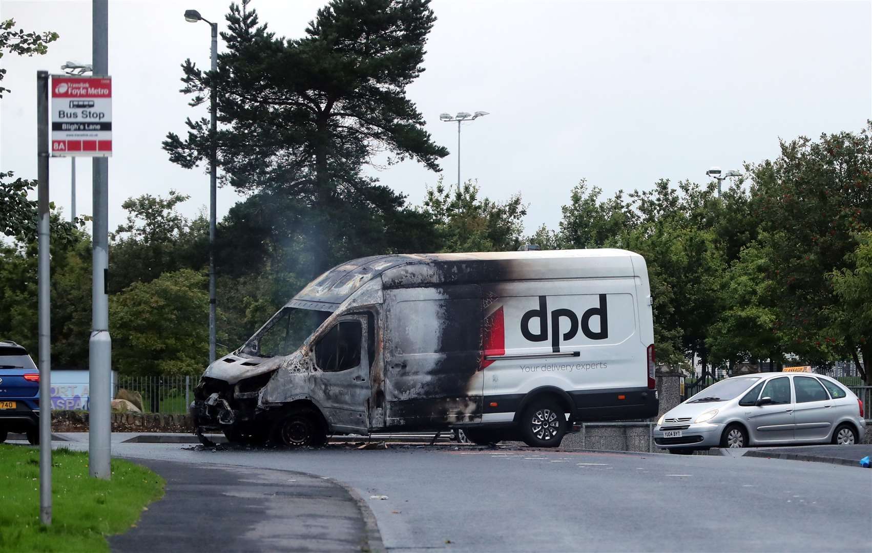 A burnt-out van in the Creggan area of Derry (Niall Carson/PA)