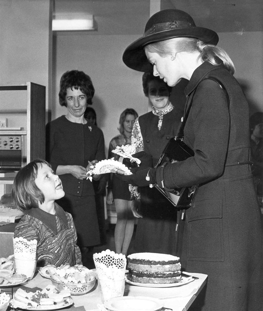 In March 1971, the Duchess of Kent unveiled a commemorative lectern to mark opening of Sheppey School. She then toured classrooms chatting to pupils and staff. Here she is seen with four-year-old Dawn Baker