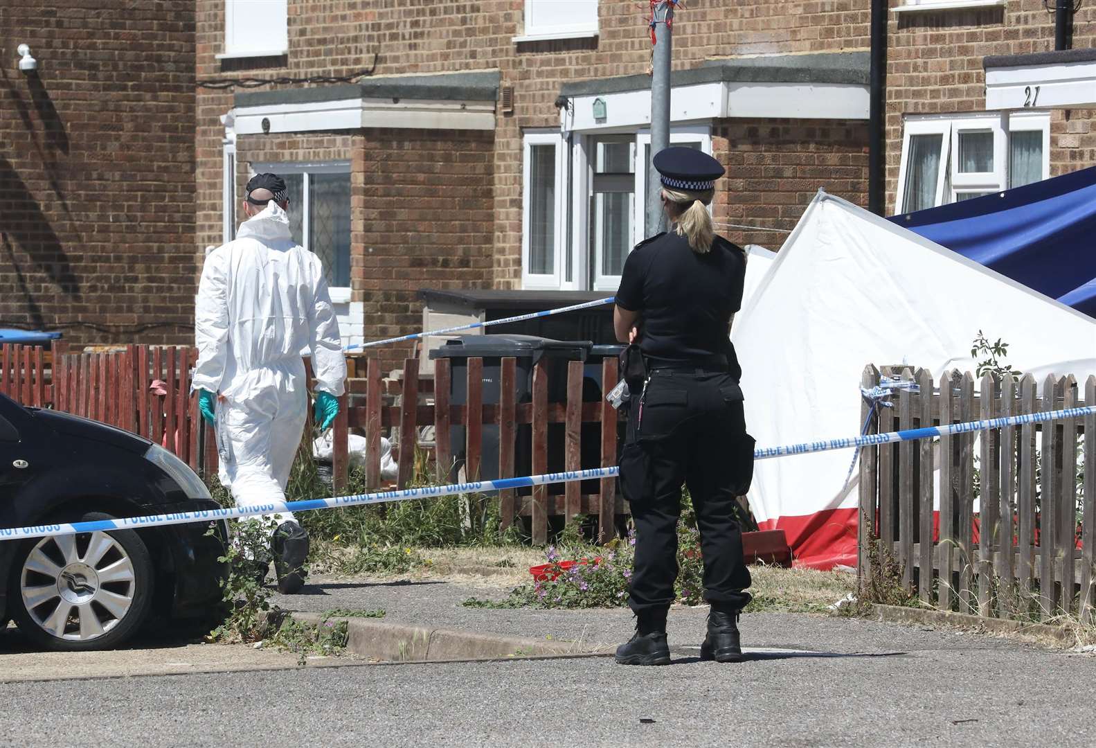 Police at the scene of the alleged murder. Picture: UKNIP