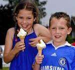 Morgan and Connor-Joe O'Sullivan enjoy an ice cream in the sun at Bearsted Fete.