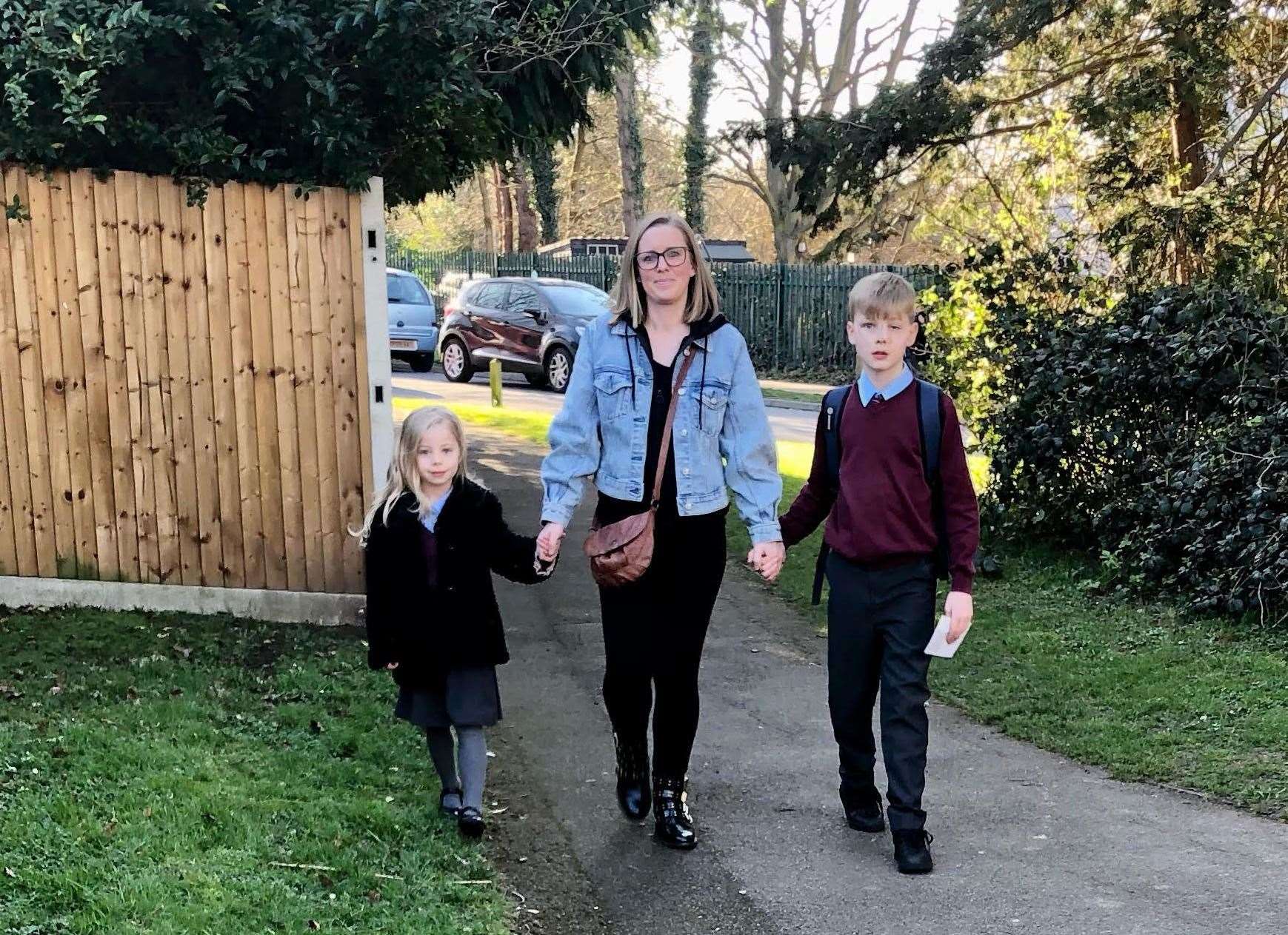 Jodie Murphy and her children Rowan and Laila walking on the walk to Tunbury Primary School where there's been a 20-year fight to improve road safety