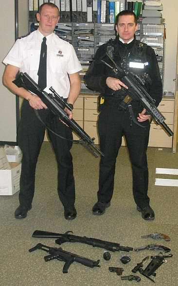 Sgt Alex Bain and PC Dave Saunders with look-a-like rifles