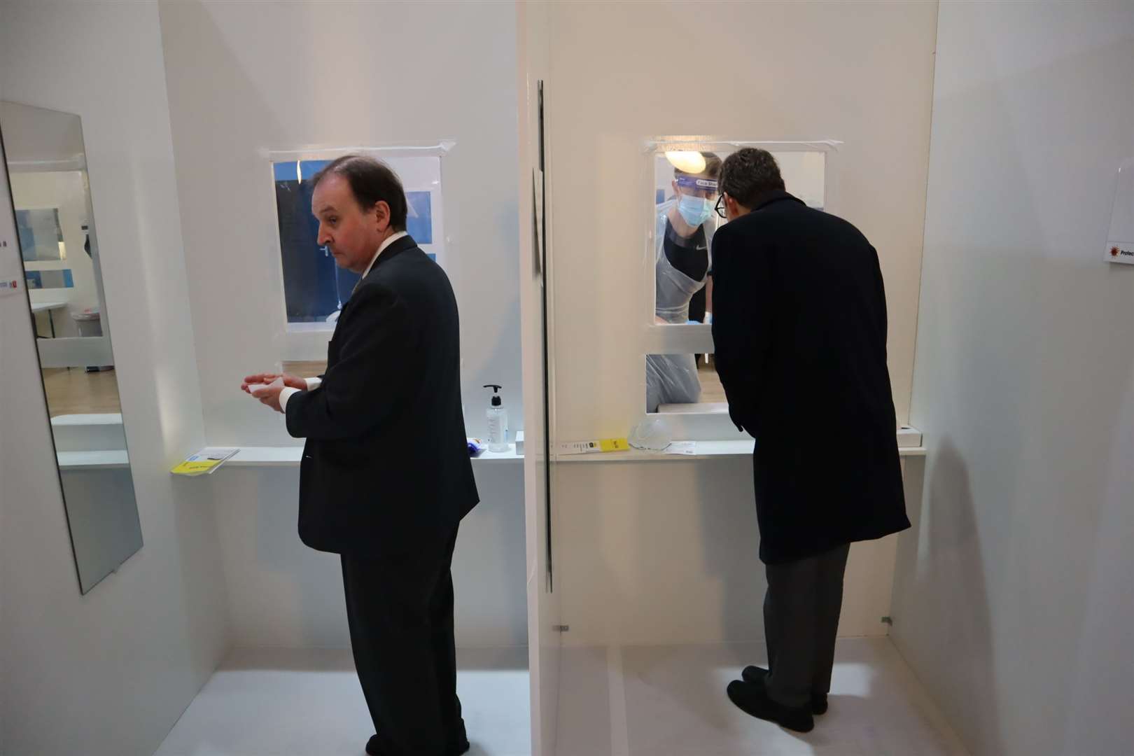 KCC leader Roger Gough, left, and Kent's director of public health Andrew Scott-Clark undergo a Covid test in Sheerness East WMC, Halfway, which opens as a mass public test centre on Friday