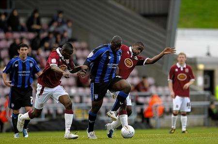 Adebayo Akinfenwa tries to muscle his way clear of a challenge.