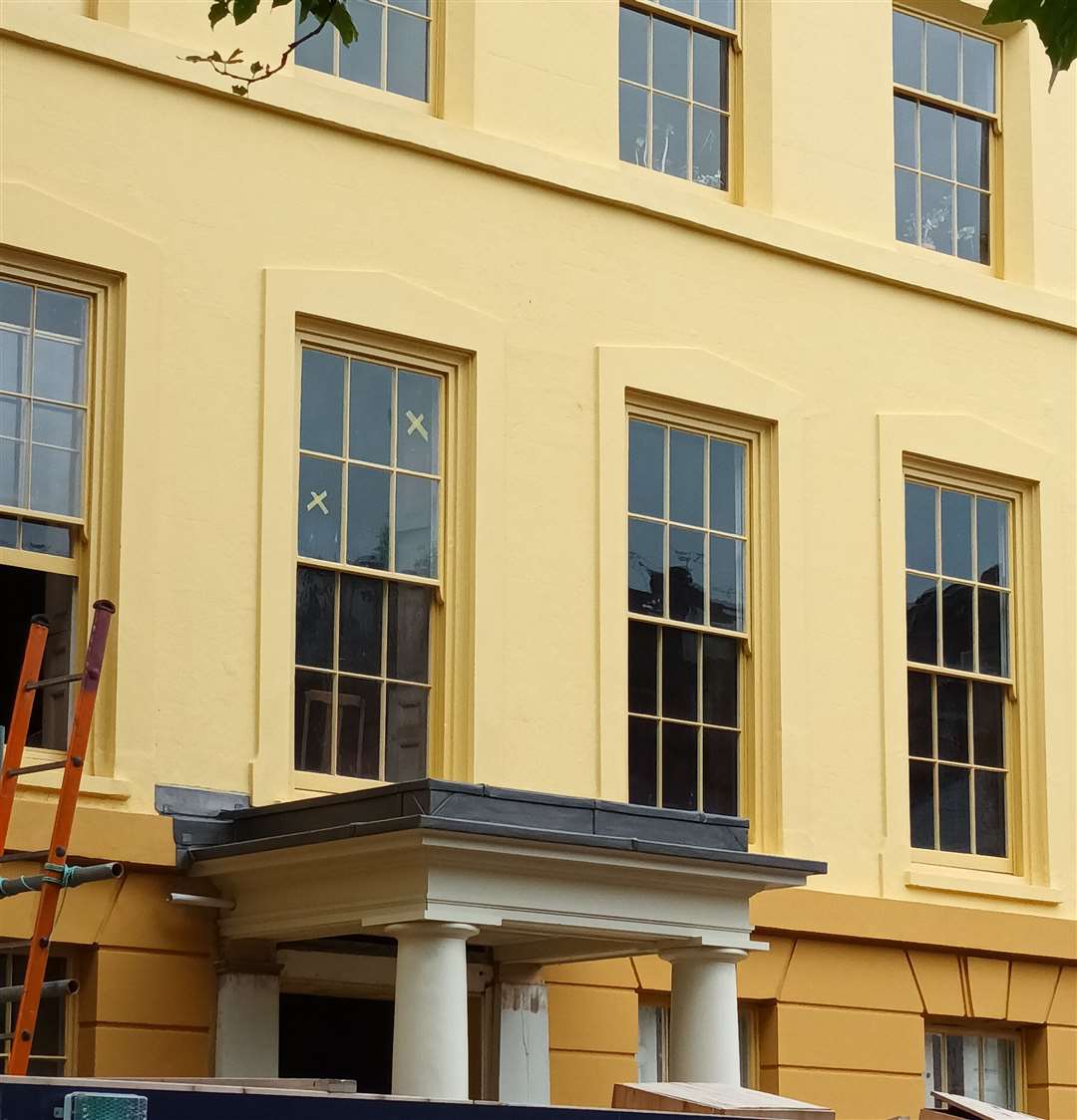 The building had its old porch reinstated and the front painted yellow. Photo: Sheila Featherstone