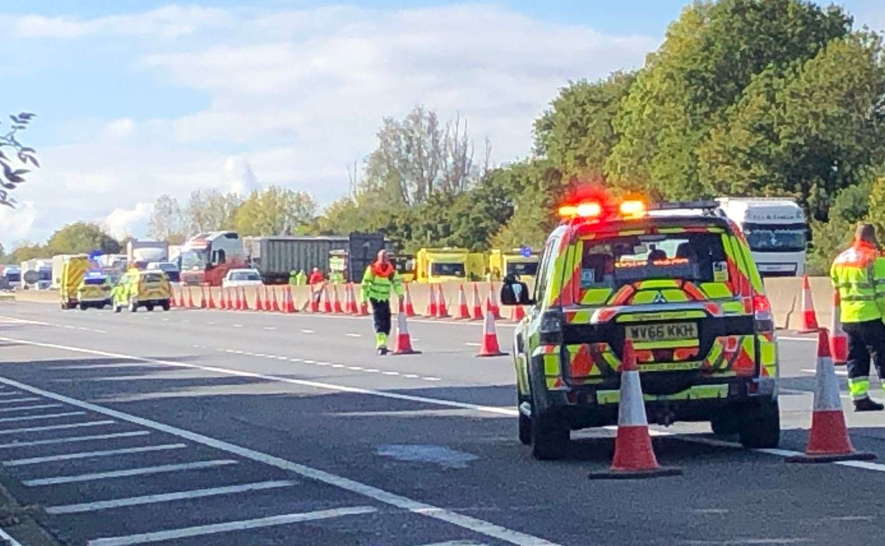 Emergency services at the scene of the crash on the M26 on Thursday