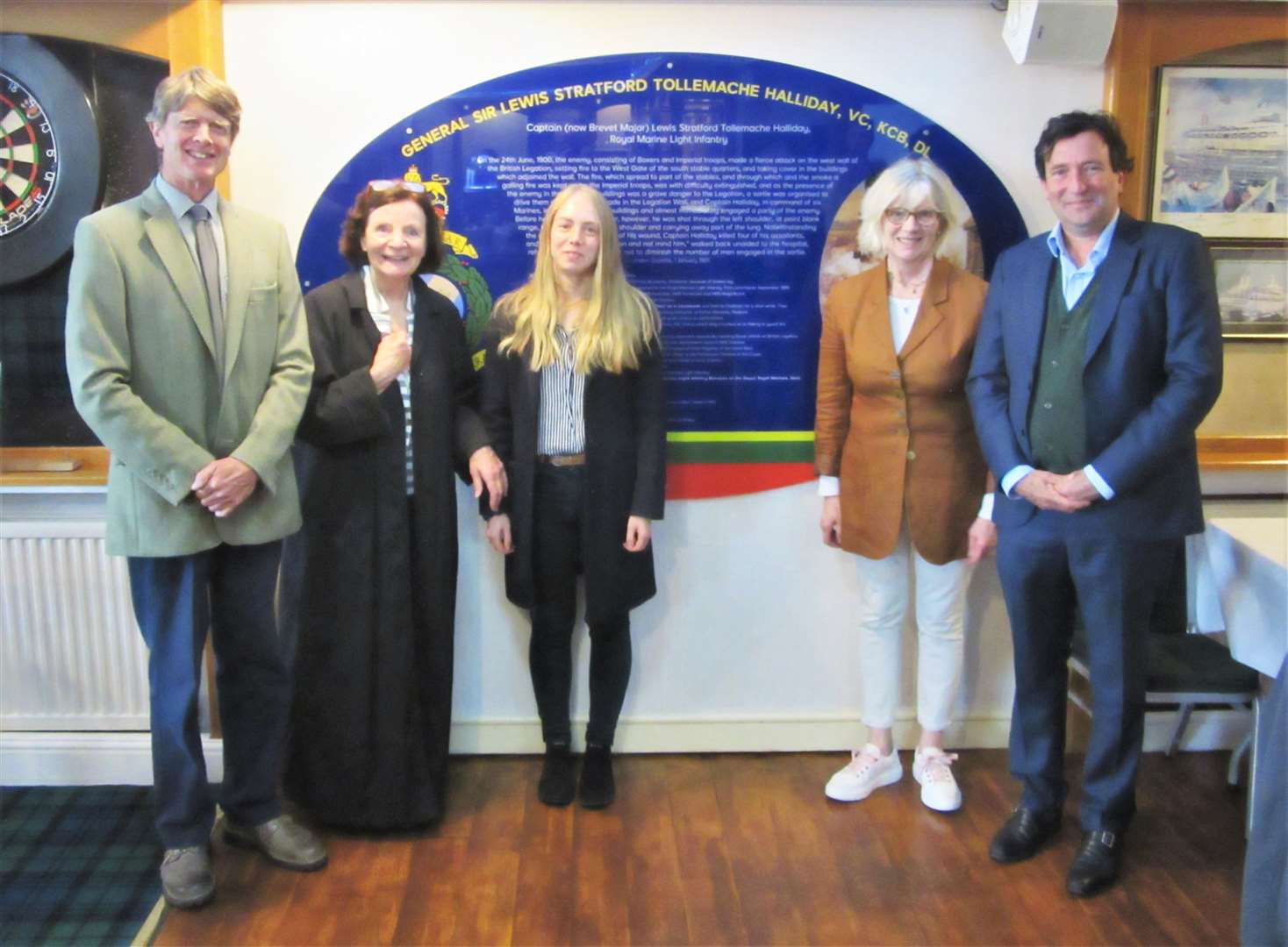 The family of Victoria Cross recipient General Sir Lewis Halliday, VC, KCB, DL, in front of the story board commissioned in his honour. Roger Halliday, his daughter Kathryn, and Halliday's grandaughters - first cousins to Roger; Alison Sutherland and Catriona Berrell (nee Sutherland) and her husband Sean