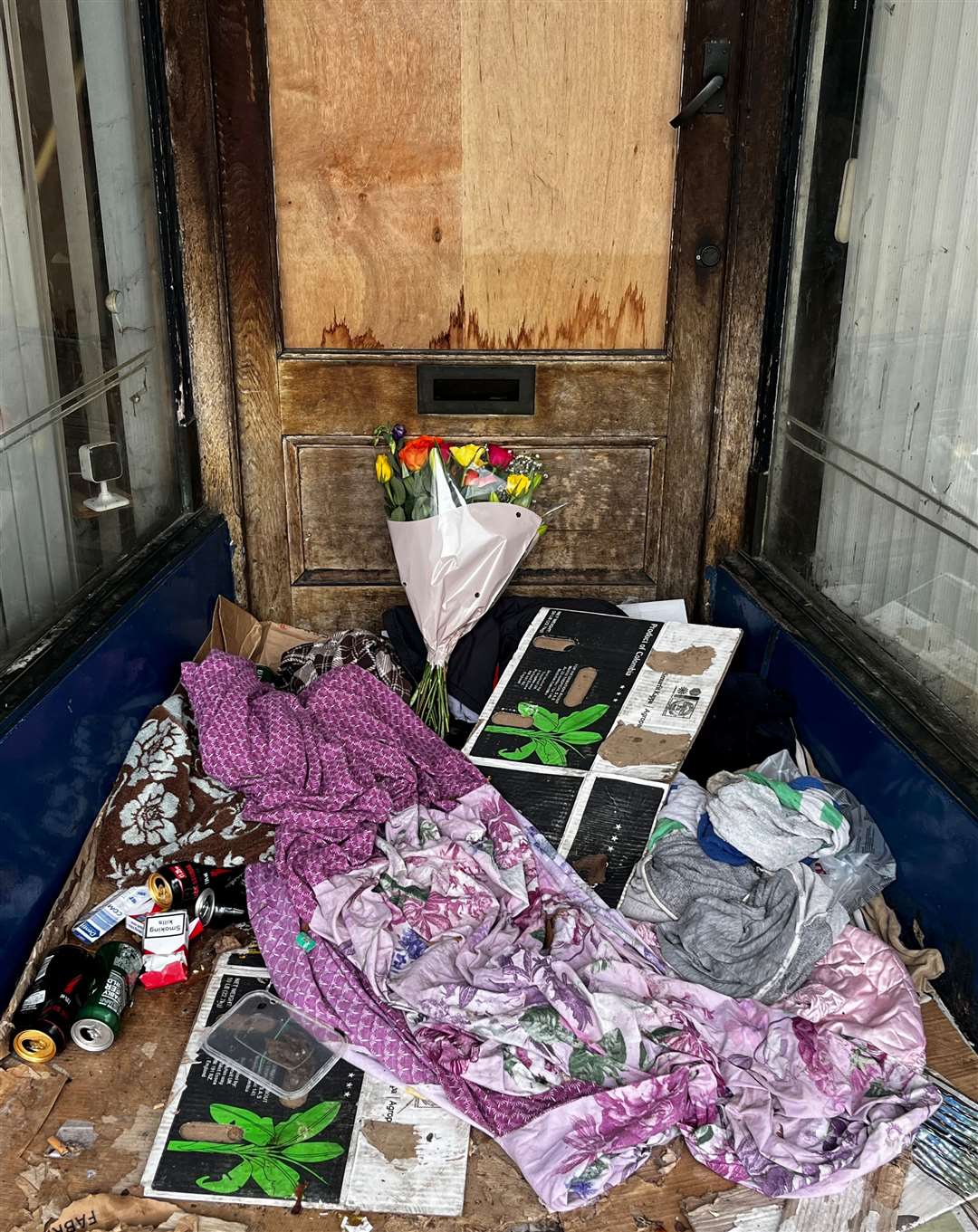 Flowers were left in the doorway where the man died in Milton Street, Gravesend