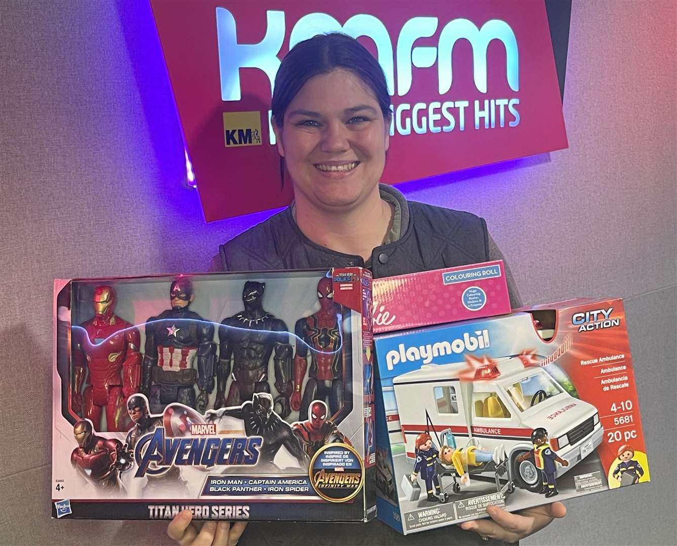 Katy Clements, community champion of Morrisons' Larkfield store, with some of the toys she dropped off to the kmfm studios