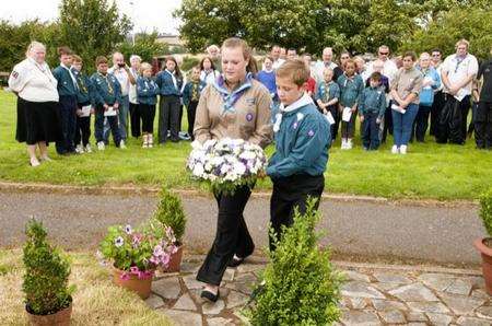Young scouts lay a wreath at the memorial service for the Leysdown Tragedy