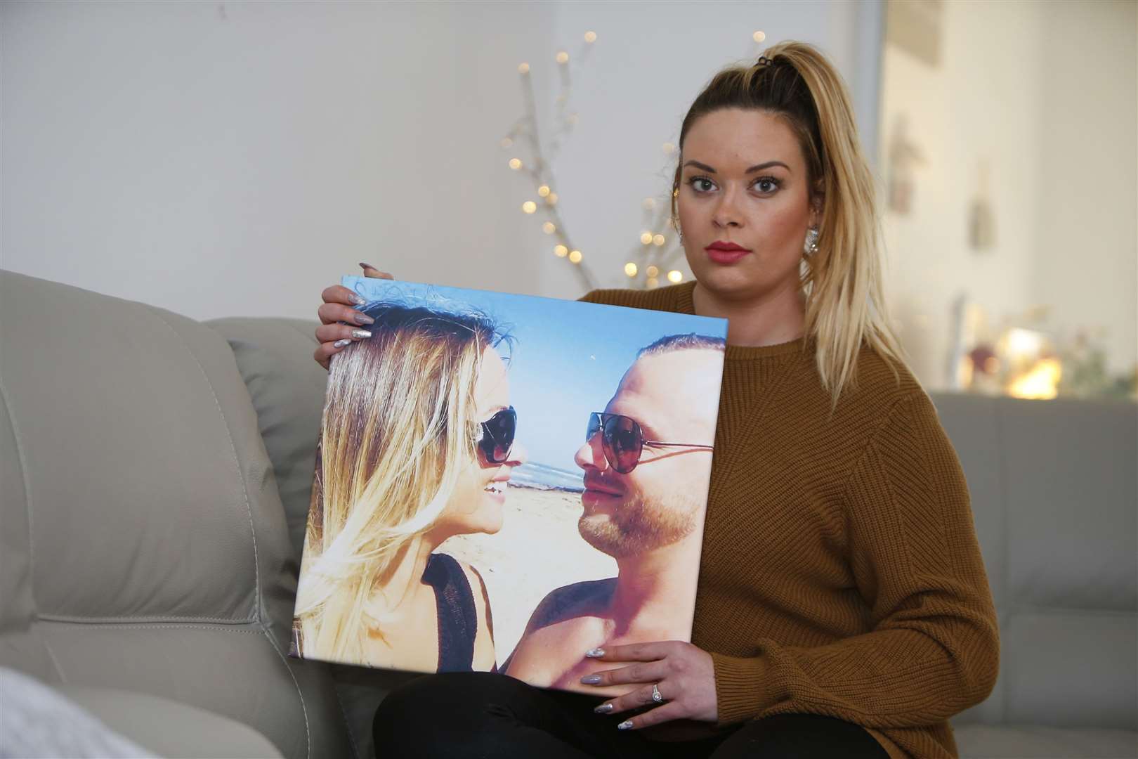 Sian Lovegrove with a picture of her partner John Hodgson Picture: Andy Jones