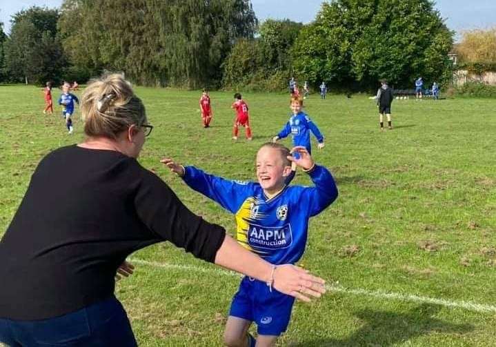 The moment captured on camera where Vicky and Kian celebrated the goal together. Picture: Vicky Holt