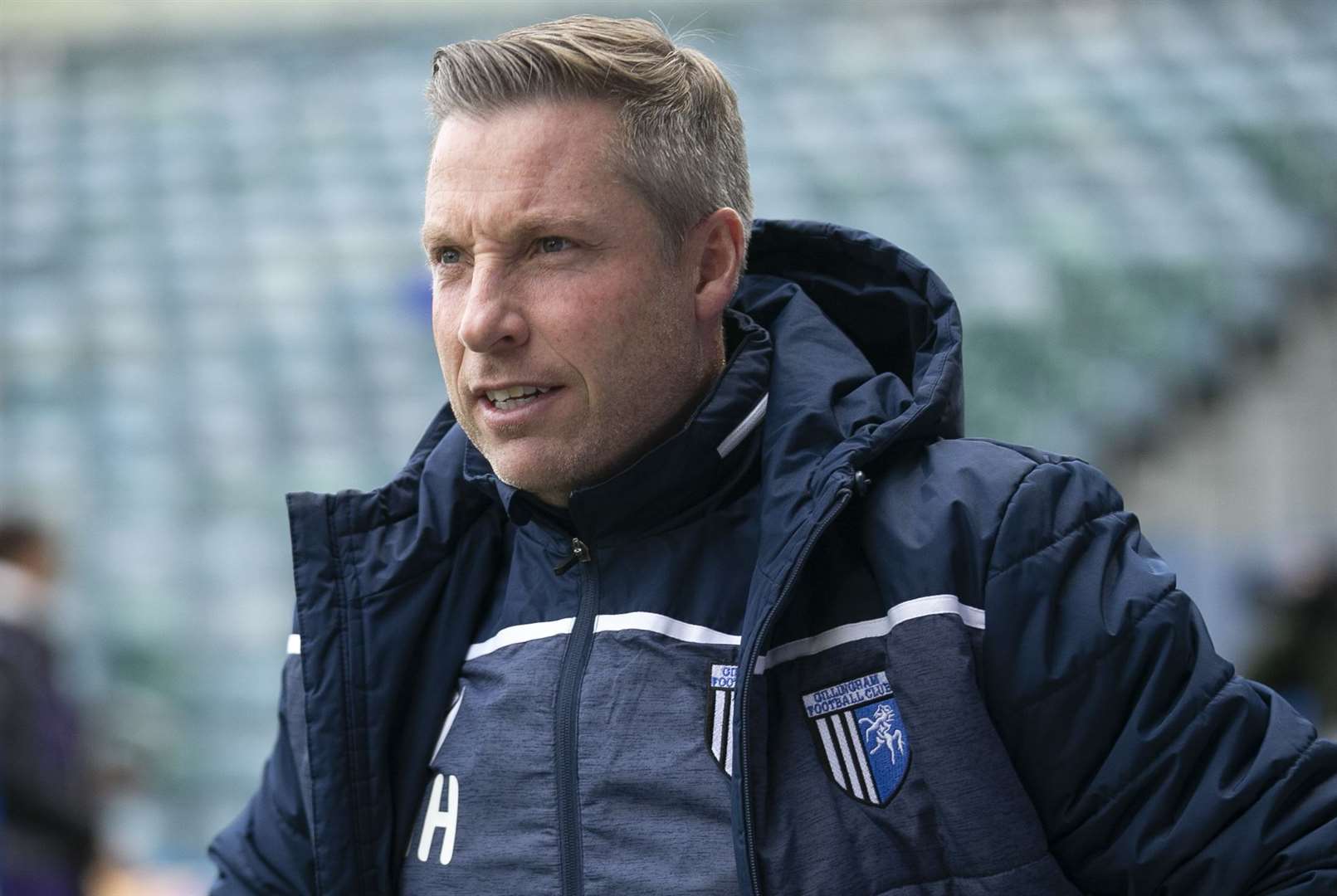 Gillingham manager Neil Harris has been defended by defender Max Ehmer