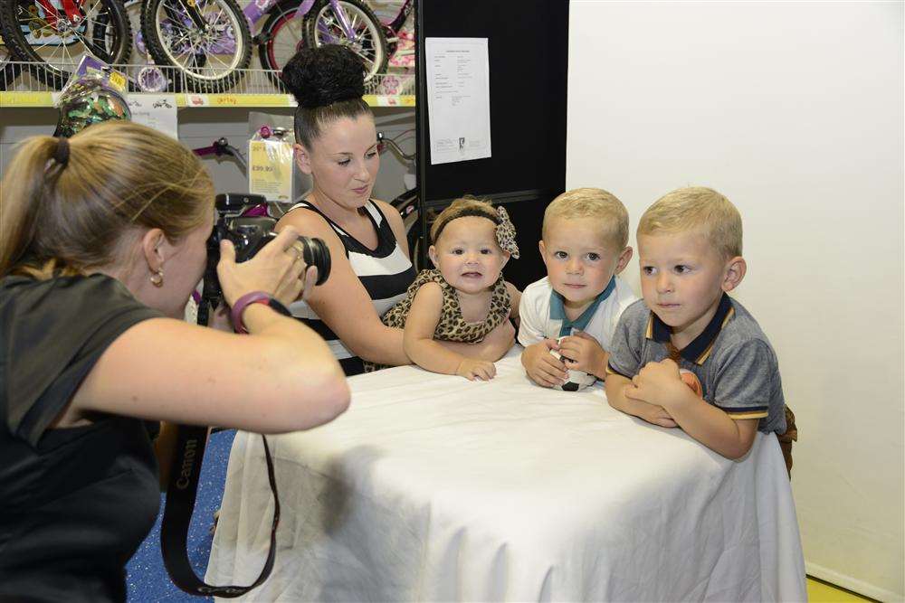 Bonnie-Mae, Franky-Joe and Deano Manser get ready to pose in our Cute Kids competition, held in conjunction with Smyths toy store in Aylesford