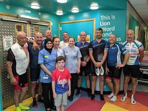 Charlie Golden pictured with Carl Moses, Graham Tonks, Lee Tonks, Charlie's dad Paul Golden, Mark Tonks, Cathal Bartolo, Steve Richards and Mark Moses with nurses at King's College Hospital, London