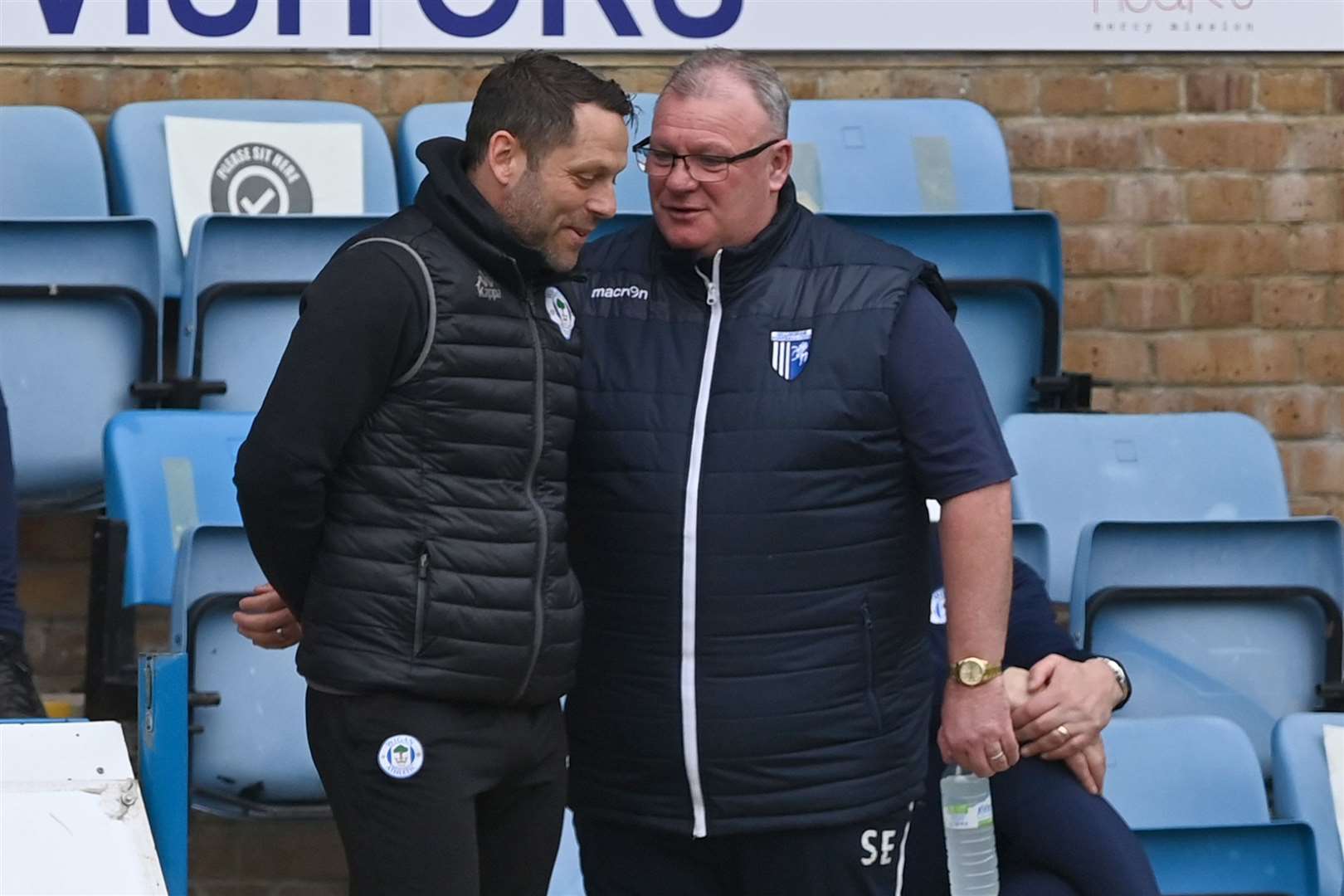 Gills boss Steve Evans chats with Wigan's Leam Richardson last season, a team who have been spending on transfer fees over the summer Picture: Keith Gillard