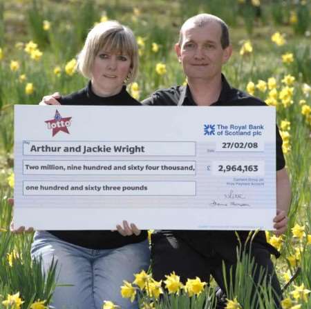 Lotto winners Jackie and Arthur Wright with their life-changing prize. Pictures: MATTHEW READING