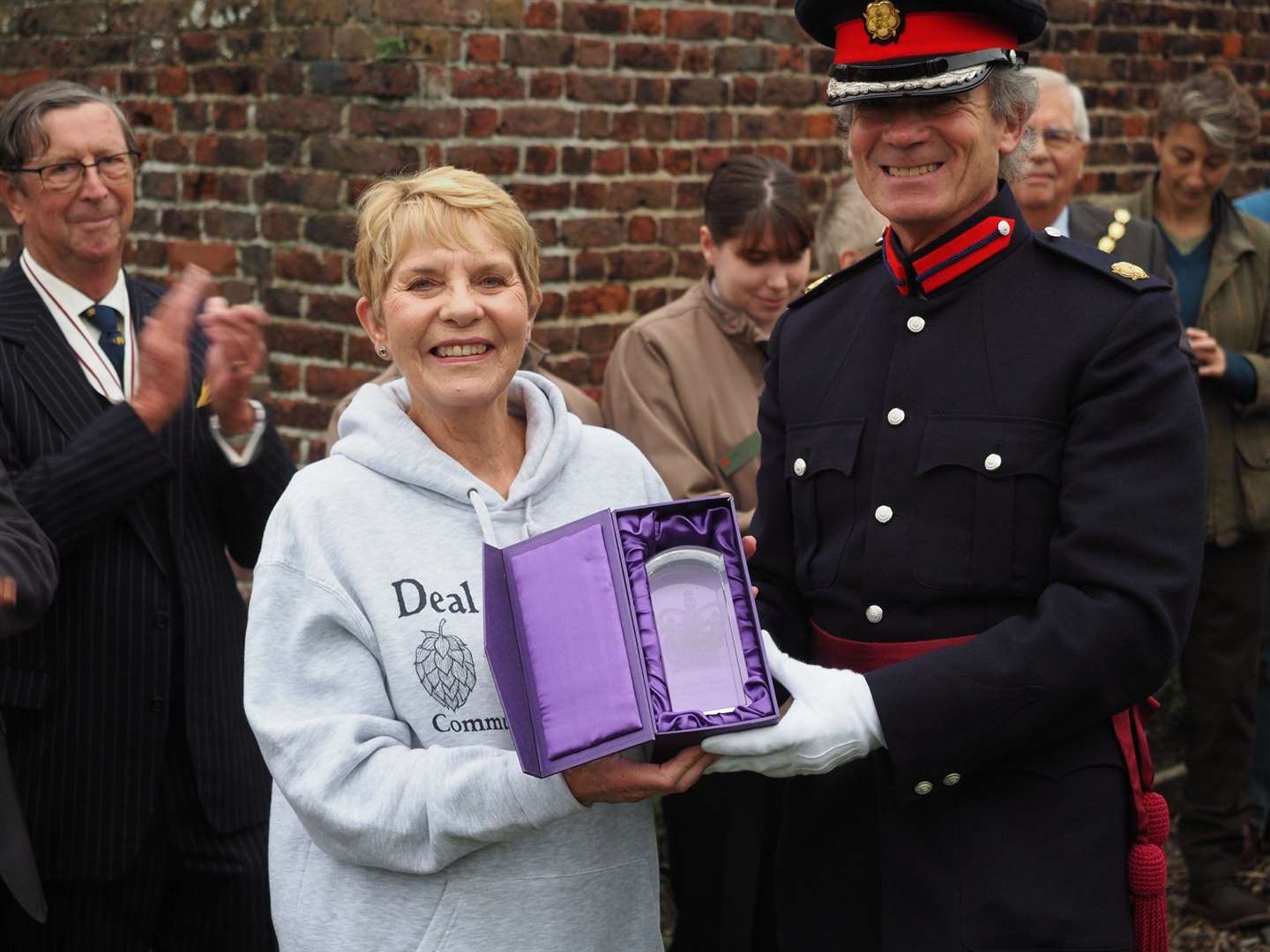 Vicki Nicholls receives the award from Vice Lord Lieutenant of Kent Richard Oldfield OBE